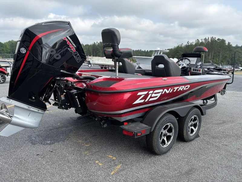 Slide: The Image of 2025 Nitro Z19 Pro boat with red and black design, parked on a trailer. - 5