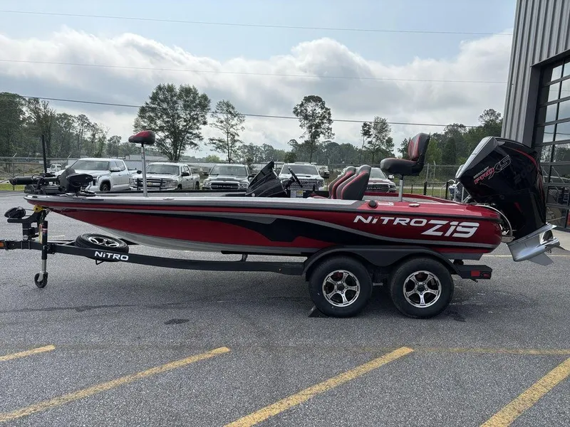 Slide: The Image of 2025 Nitro Z19 Pro boat on trailer, parked outdoors near a building. - 6