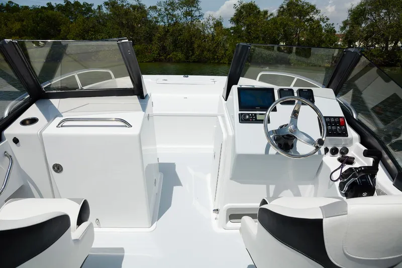 Slide: The Image of 2025 ArrowCat 20DC boat interior with dual consoles and modern steering wheel. - 4