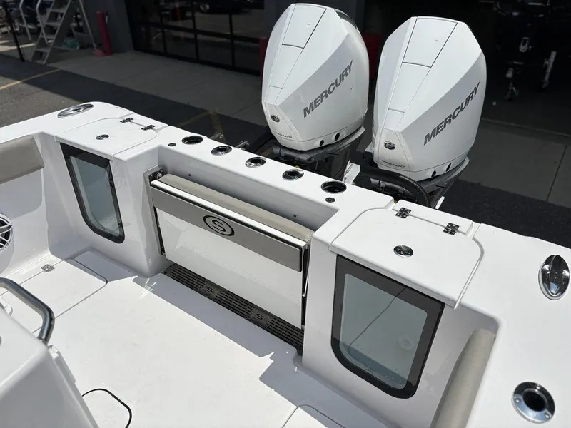 Slide: The Image of 2025 Sportsman OPEN 262 boat with dual Mercury engines, featuring a sleek white design. - 10