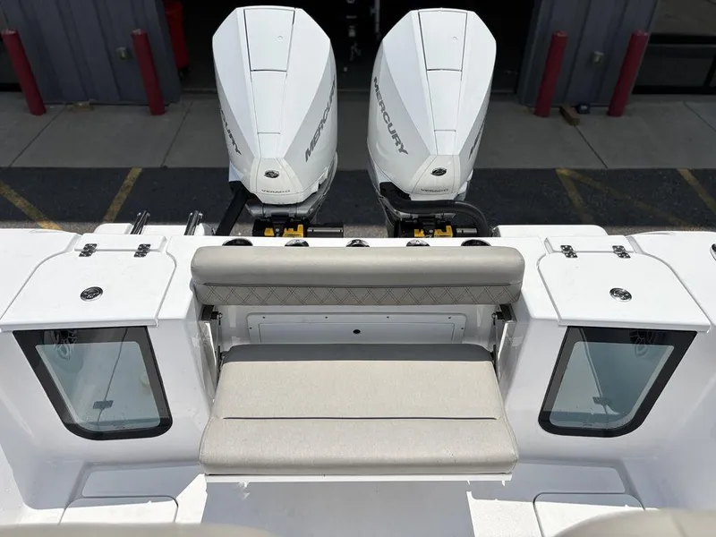 Slide: The Image of 2025 Sportsman OPEN 262 boat with dual Mercury engines and cushioned seating. - 14