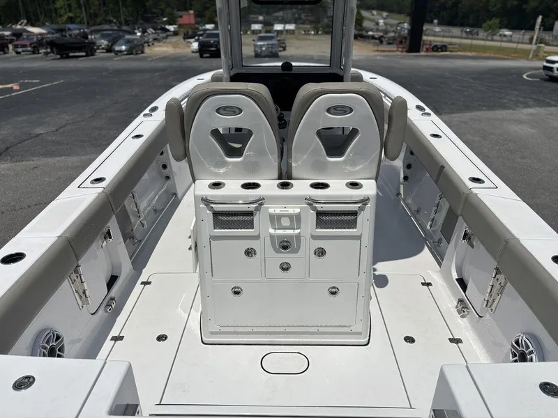 Slide: The Image of 2025 Sportsman OPEN 262 boat interior with dual seats and storage compartments. - 16