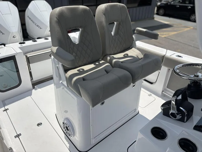 Slide: The Image of 2025 Sportsman OPEN 262 boat interior with dual seats and steering console. - 18