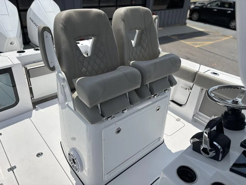 Slide: The Image of 2025 Sportsman OPEN 262 boat seats with modern design and steering wheel. - 21