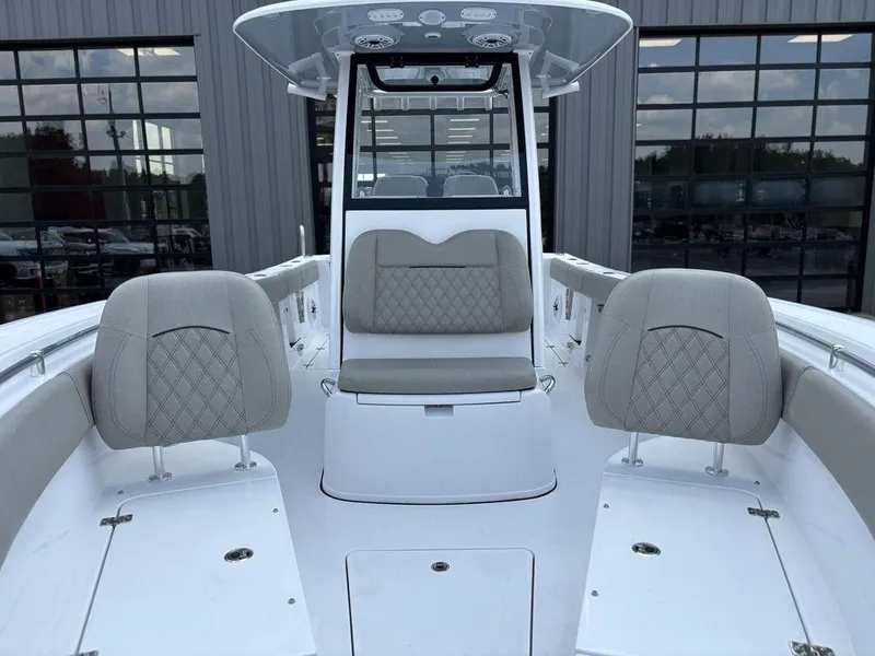 Slide: The Image of 2025 Sportsman OPEN 262 boat interior with cushioned seating and modern design. - 23
