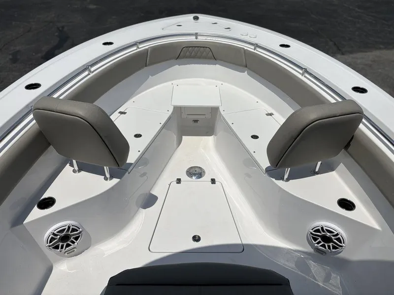 Slide: The Image of 2025 Sportsman OPEN 262 boat interior with seating and speakers. - 26