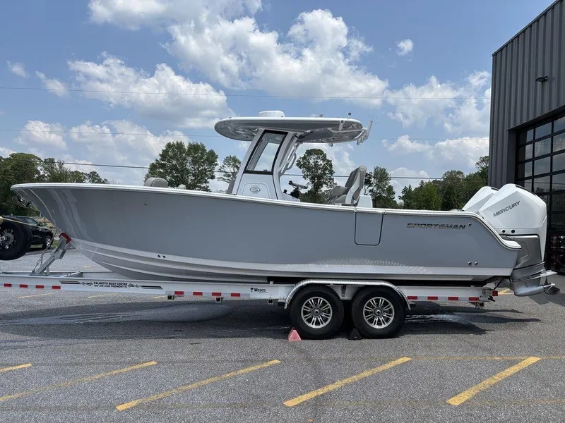 Slide: The Image of 2025 Sportsman OPEN 262 boat on trailer, parked outdoors under a clear sky. - 4