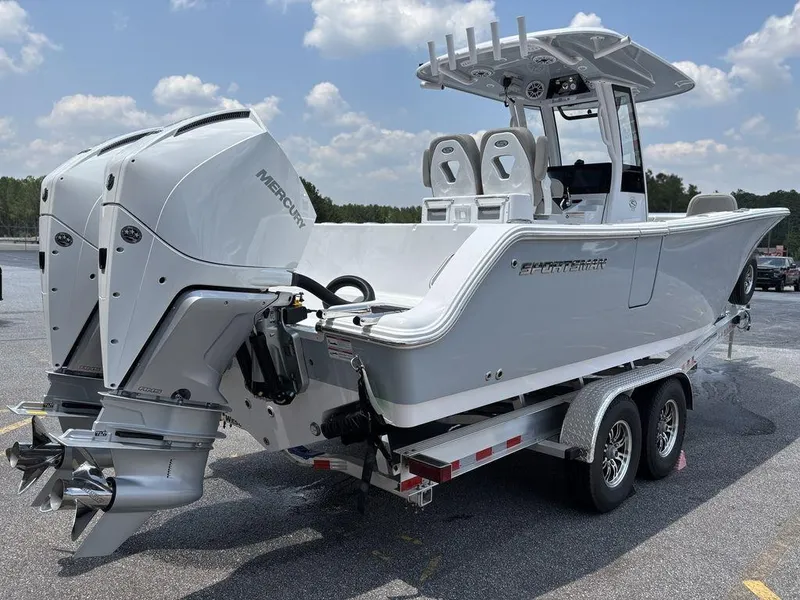 Slide: The Image of 2025 Sportsman OPEN 262 boat on trailer with dual engines, parked outdoors. - 7