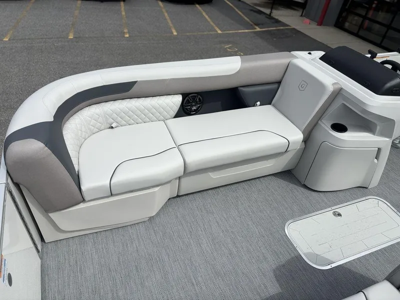 Slide: The Image of 2025 Godfrey SWEETWATER 2286 SFL boat interior with plush seating and modern design. - 11