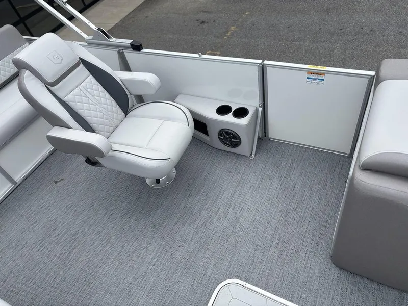 Slide: The Image of 2025 Godfrey SWEETWATER 2286 SFL boat interior with swivel chair and cup holders. - 8