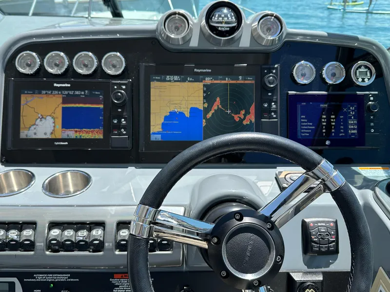 Slide: The Image of 2017 Formula 370 Super Sport dashboard with navigation screens and controls. - 12