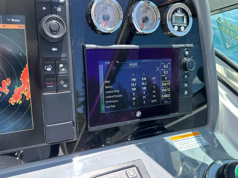 Slide: The Image of 2017 Formula 370 Super Sport dashboard with engine metrics and navigation display. - 13