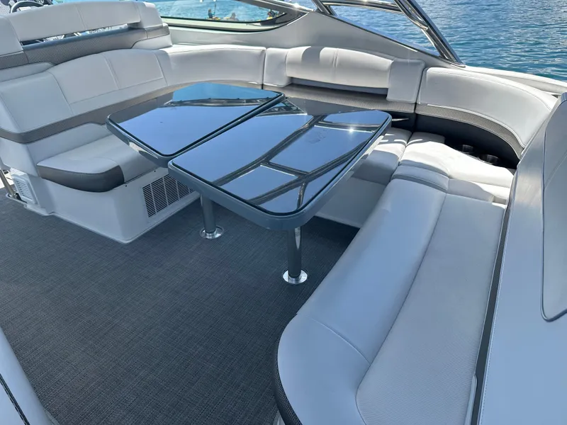 Slide: The Image of 2017 Formula 370 Super Sport boat interior with sleek seating and glass tables. - 20