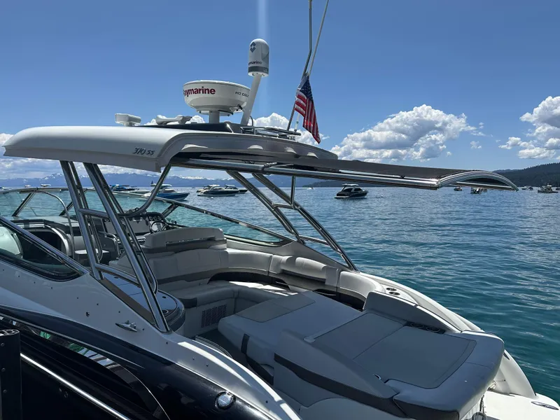Slide: The Image of 2017 Formula 370 Super Sport boat on a sunny lake with clear skies. - 25