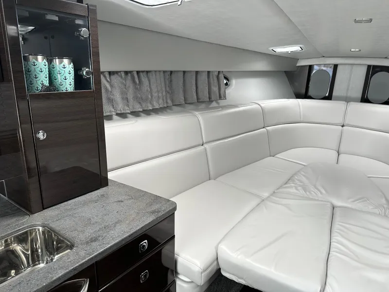 Slide: The Image of Luxurious interior of 2017 Formula 370 Super Sport yacht with white leather seating and modern cabinetry. - 29