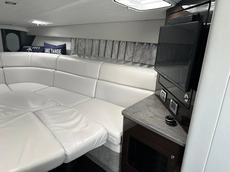 Slide: The Image of Interior of 2017 Formula 370 Super Sport boat with white leather seating and TV. - 30