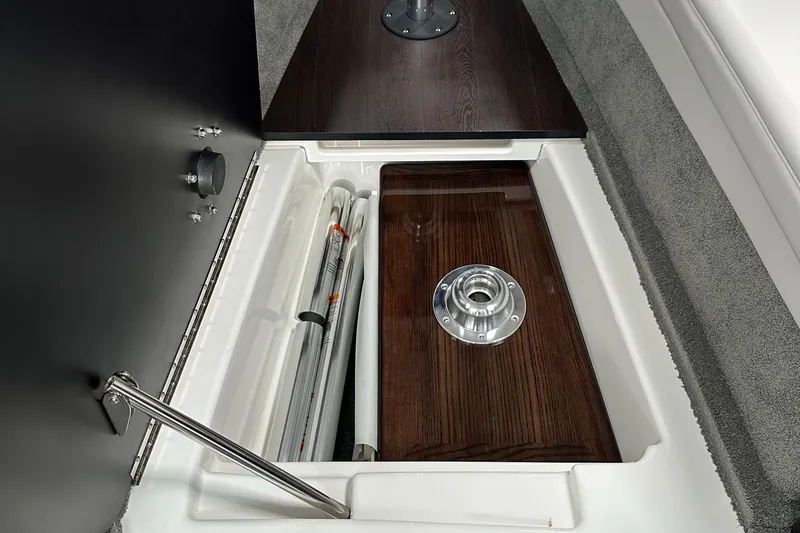 Slide: The Image of 2017 Formula 370 Super Sport storage compartment with wooden finish and metal fittings. - 31