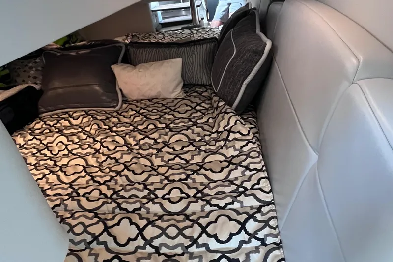 Slide: The Image of Interior cabin of a 2017 Formula 370 Super Sport with patterned bedding and cushions. - 34