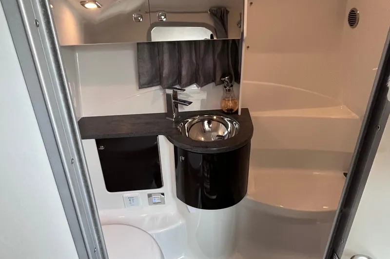 Slide: The Image of 2017 Formula 370 Super Sport boat bathroom with modern sink and sleek design. - 38