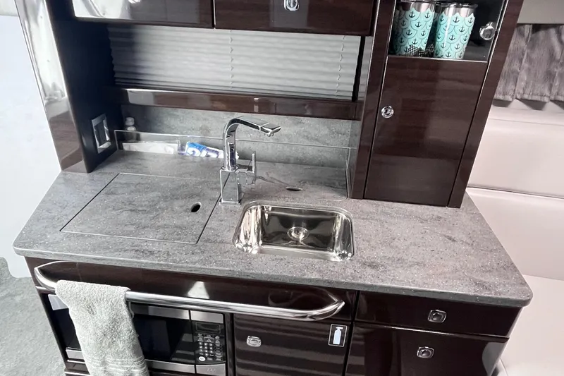 Slide: The Image of 2017 Formula 370 Super Sport yacht kitchen with sleek countertop and modern appliances. - 41