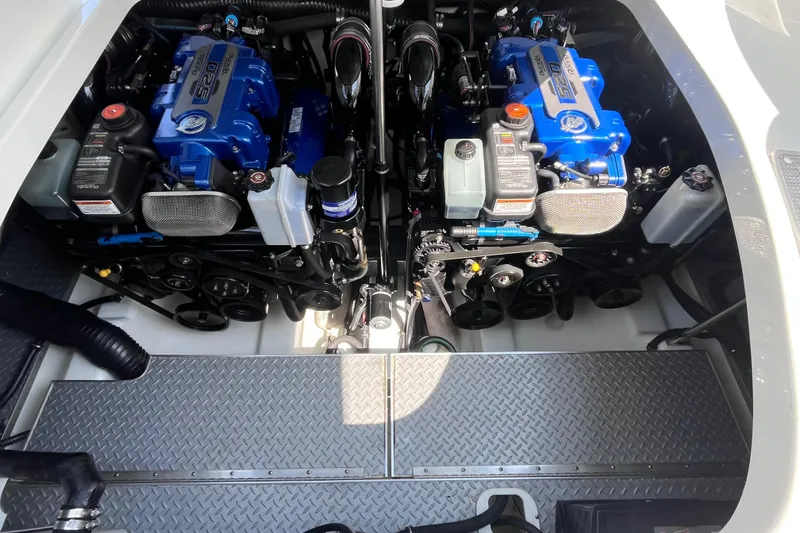 Slide: The Image of Engine compartment of a 2017 Formula 370 Super Sport boat with dual blue engines. - 42