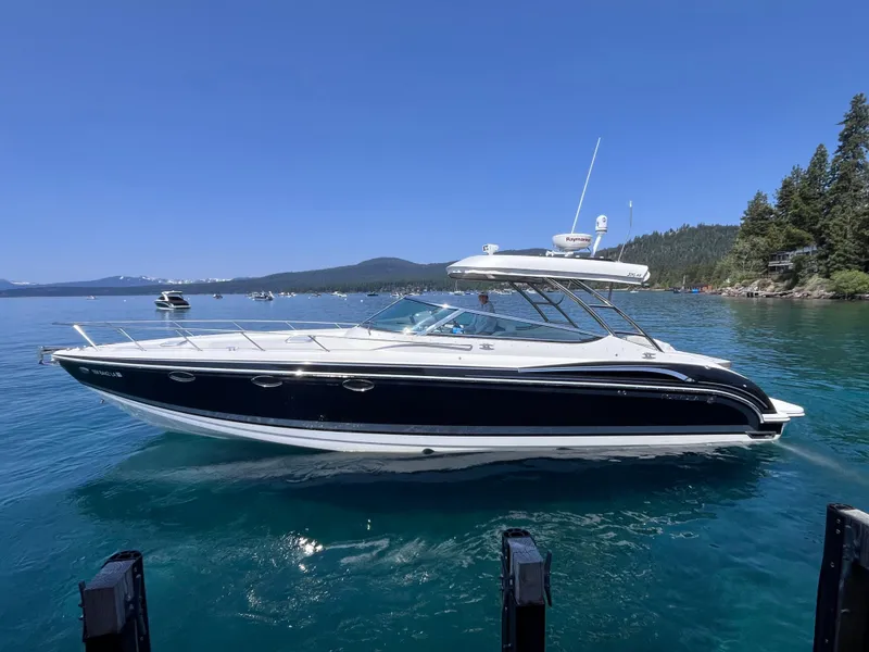 Slide: The Image of 2017 Formula 370 Super Sport boat on clear blue water, surrounded by scenic landscape. - 6