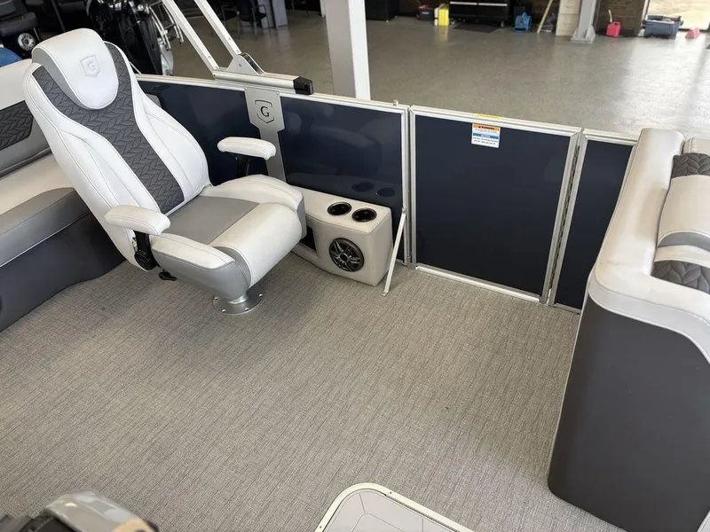 Slide: The Image of 2025 Godfrey Monaco 235 SFL interior with captain's chair and cup holders. - 12