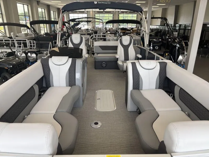 Slide: The Image of 2025 Godfrey Monaco 235 SFL pontoon boat interior with luxurious seating and modern design. - 13
