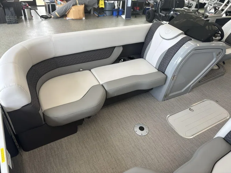 Slide: The Image of 2025 Godfrey Monaco 235 SFL boat interior with gray seating and modern design. - 14