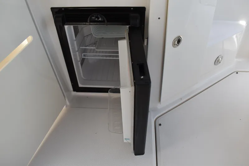 Slide: The Image of Open mini fridge on 2011 Sea Ray 310 Sundancer boat deck. - 16