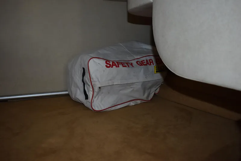 Slide: The Image of Safety gear bag inside 2011 Sea Ray 310 Sundancer boat cabin. - 50