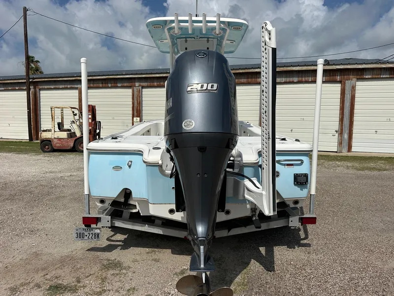 Slide: The Image of 2019 Sea Hunt BX 22 BR boat with 200 HP engine, parked outdoors. - 1