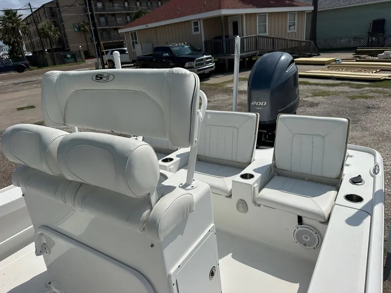 Slide: The Image of 2019 Sea Hunt BX 22 BR boat interior with seating and outboard motor. - 5