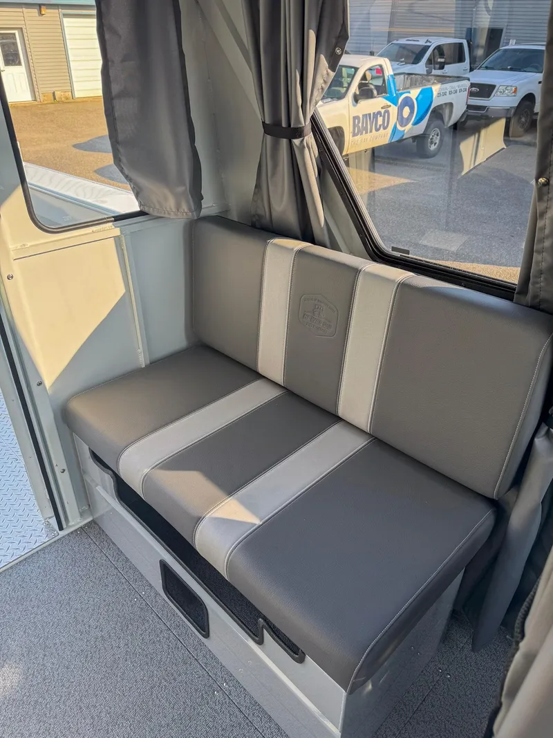 Slide: The Image of 2024 Hewescraft 240 Ocean Pro ET HT interior with gray seating and window view. - 7