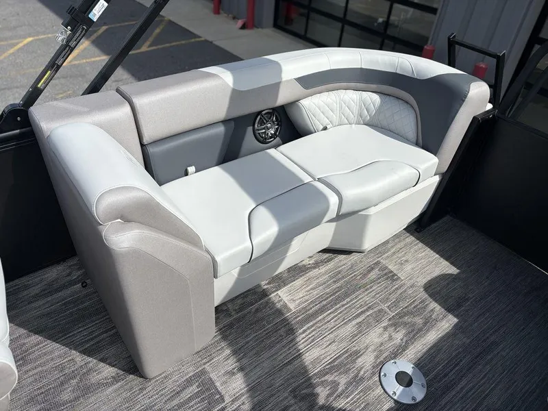 Slide: The Image of 2025 Godfrey SWEETWATER 2286 SB boat interior with gray seating and modern design. - 12