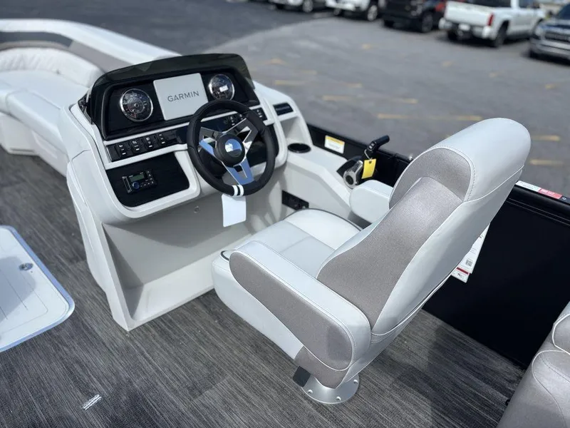 Slide: The Image of 2025 Godfrey SWEETWATER 2286 SB boat interior with Garmin dashboard and captain's chair. - 15