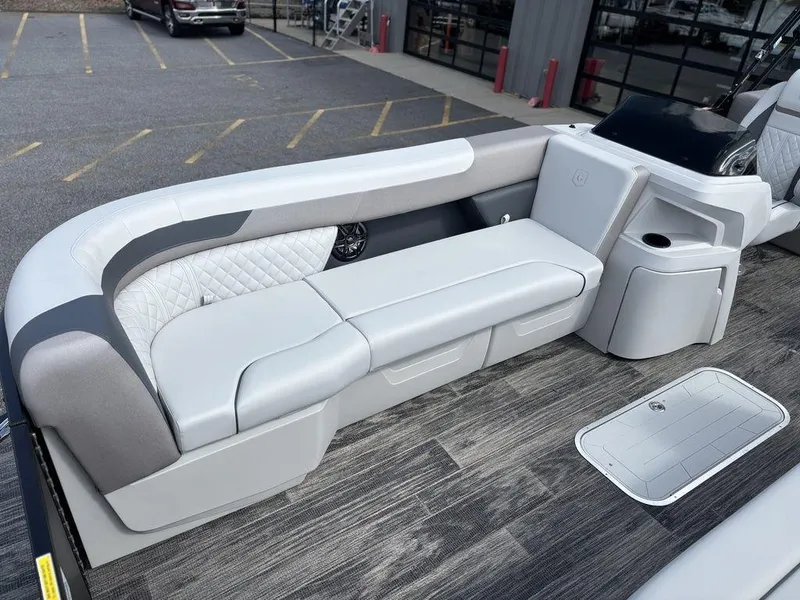 Slide: The Image of 2025 Godfrey SWEETWATER 2286 SB boat interior with sleek seating and modern design. - 4