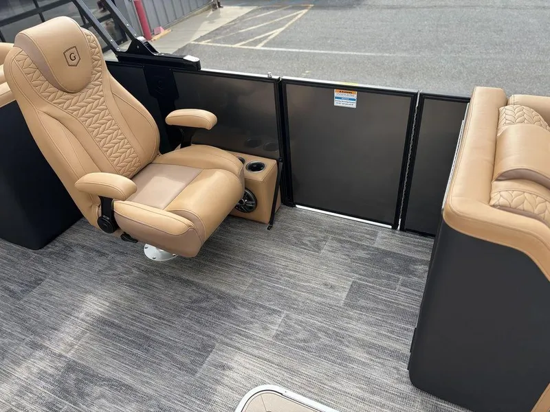 Slide: The Image of Luxurious seating on 2025 Godfrey Monaco 235 SB boat with tan upholstery and modern design. - 20