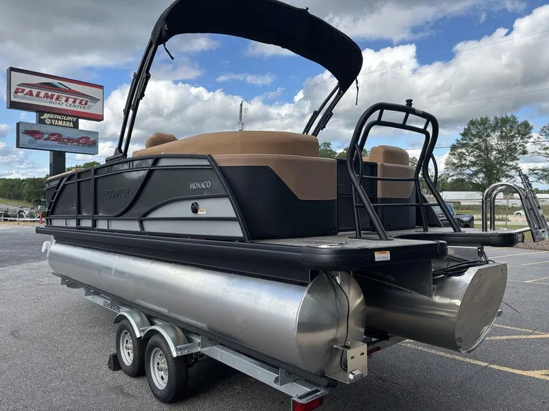 Slide: The Image of 2025 Godfrey Monaco 235 SB pontoon boat on trailer, outdoor dealership display. - 3