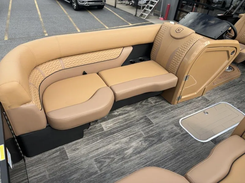 Slide: The Image of Luxurious seating on 2025 Godfrey Monaco 235 SB pontoon boat with tan upholstery. - 9