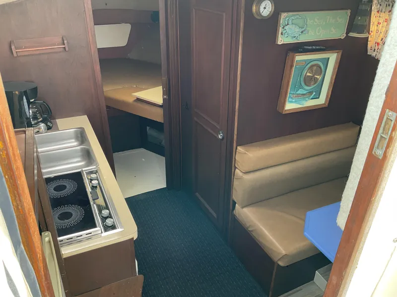 Slide: The Image of Interior of 1985 Cruisers Yachts 291 Sea Devil with kitchenette and seating area. - 11