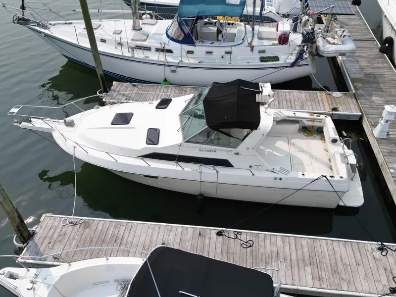 Slide: The Image of 1985 Cruisers Yachts 291 Sea Devil docked at marina, aerial view. - 4