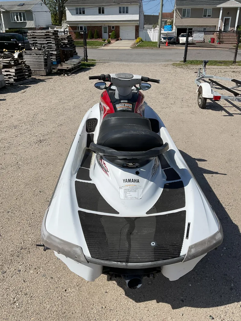 Slide: The Image of 2005 Yamaha WaveRunner FX Cruiser jet ski parked on gravel driveway. - 4