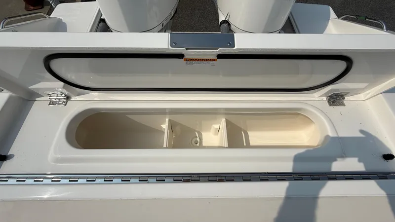 Slide: The Image of Open storage compartment on 2025 Pursuit S 328 Sport boat. - 14