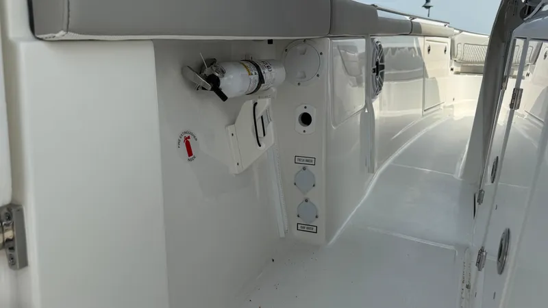 Slide: The Image of 2025 Pursuit S 328 Sport boat interior with safety equipment and sleek design. - 22