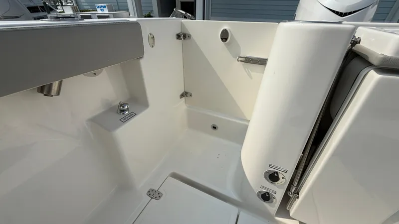 Slide: The Image of 2025 Pursuit S 328 Sport boat interior, featuring sleek white design and modern fixtures. - 29