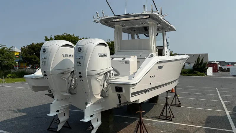 Slide: The Image of 2025 Pursuit S 328 Sport boat with twin Yamaha engines on display. - 4