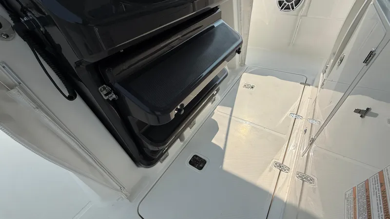 Slide: The Image of 2025 Pursuit S 328 Sport boat interior with storage compartments and sleek design. - 48
