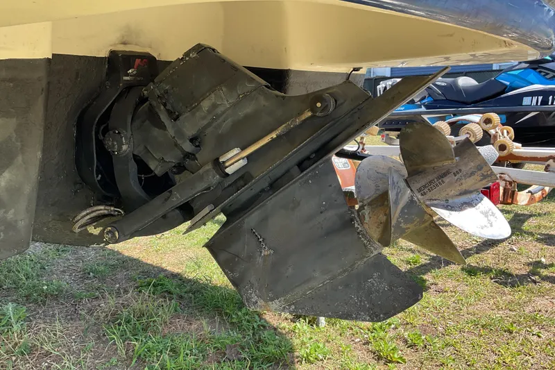 Slide: The Image of 2006 Chaparral 256 SSi boat propeller and drive system on grassy surface. - 13