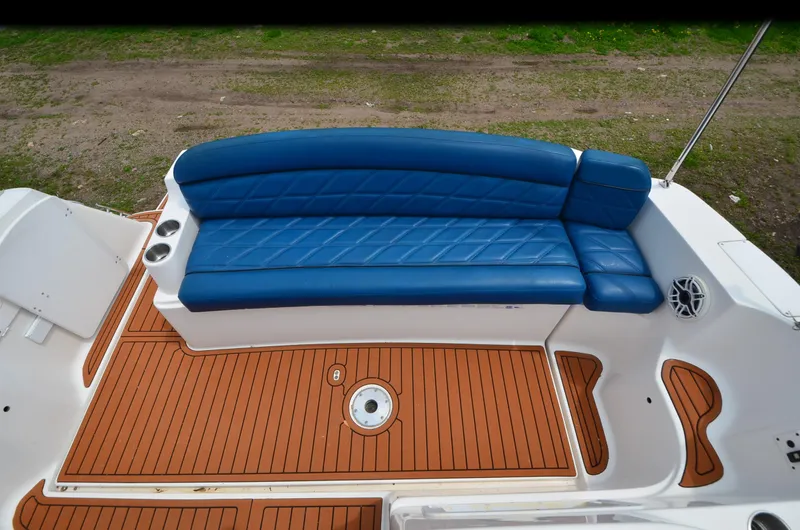 Slide: The Image of 2006 Rinker 342 Fiesta Vee boat with blue seating and teak deck. - 22
